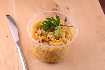 Image showing Chinese cuisine - fried rice with meat on wooden background