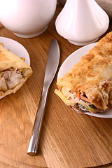 Image showing A plate of breakfast burritos with salsa