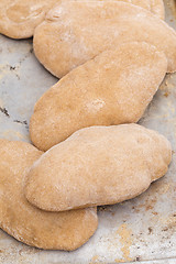 Image showing Loaves of homemade pita bread vertical