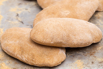 Image showing Loaves of puffed homemade Egyptian pita