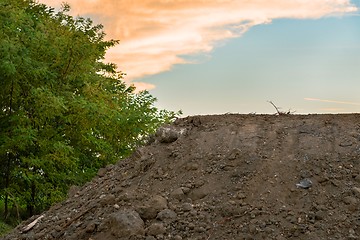 Image showing Large pile of soil under blue sky