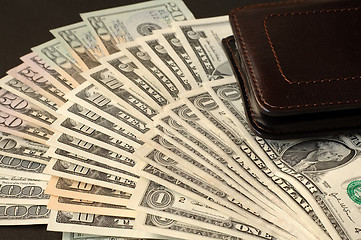 Image showing US dollars and leather wallet