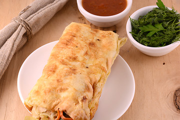 Image showing Burrito - traditional Mexican food, on a white plate