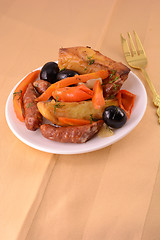 Image showing Grilled sausage with fresh salad on wooden background
