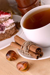 Image showing cinnamon cake and tea with sweet chocolate cake