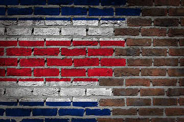 Image showing Brick wall texture with flag