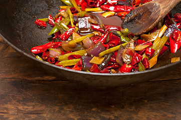 Image showing fried chili pepper and vegetable on a wok pan