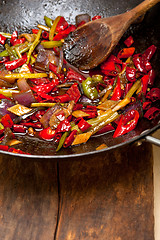 Image showing fried chili pepper and vegetable on a wok pan