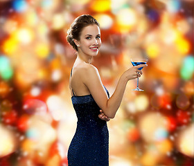 Image showing smiling woman holding cocktail