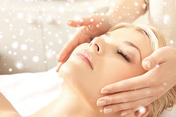 Image showing beautiful woman getting face or head massage