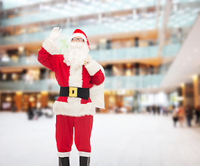 Image showing man in costume of santa claus with bag