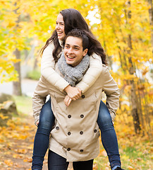 Image showing smiling couple having fun in autumn park