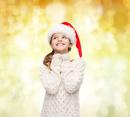 Image showing dreaming girl in santa helper hat