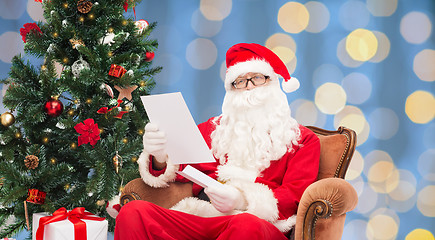 Image showing man in costume of santa claus with letter