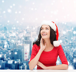 Image showing smiling woman in santa helper hat