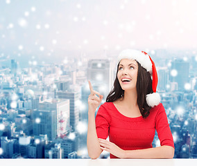 Image showing smiling woman in santa helper hat