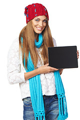 Image showing Winter woman showing tablet screen