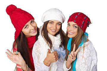 Image showing Three girls showing approving gestures