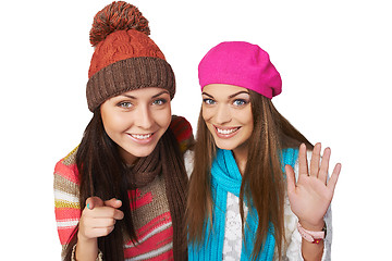 Image showing Two girl peeping into camera