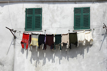 Image showing Drying clothes on the wall