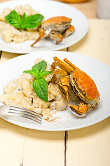 Image showing Italian gnocchi with seafood sauce with crab and basil