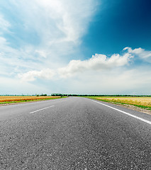 Image showing black asphalt road and clouds in dramatic sky