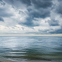 Image showing low dramatic clouds over dark water