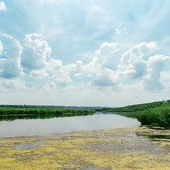 Image showing clouds in blue sky over river