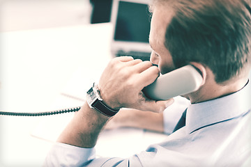 Image showing handsome businessman talking on the phone