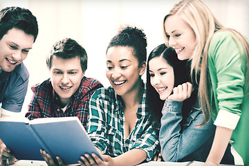 Image showing students reading book at school