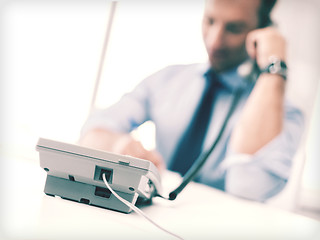 Image showing handsome businessman talking on the phone