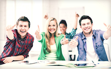 Image showing students showing thumbs up at school