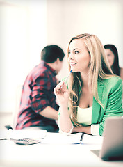 Image showing student girl with notebook and calculator