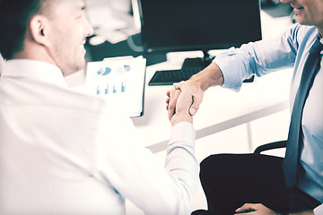 Image showing businessmen shaking hands in office