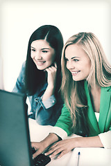 Image showing students looking at tablet pc at school