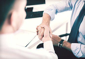 Image showing businessmen shaking hands in office