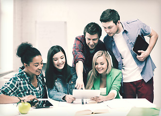 Image showing students looking at tablet pc at school