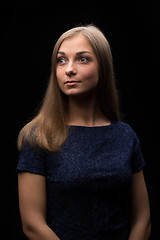 Image showing Portrait of a beautiful girl on a black background
