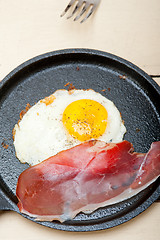Image showing egg sunny side up with italian speck ham