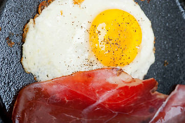 Image showing egg sunny side up with italian speck ham