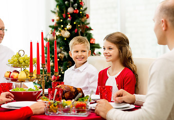 Image showing smiling family having holiday dinner at home