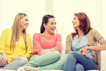 Image showing three girlfriends having a talk at home