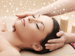 Image showing beautiful woman getting face or head massage