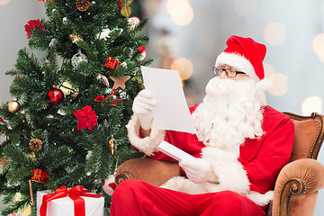 Image showing man in costume of santa claus with letter