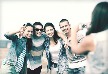 Image showing teenagers taking photo outside