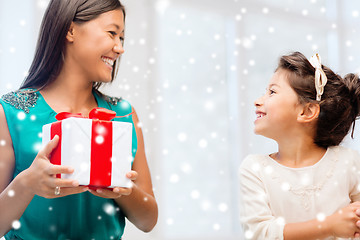 Image showing happy mother and child girl with gift box