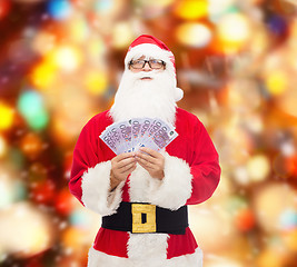 Image showing man in costume of santa claus with euro money