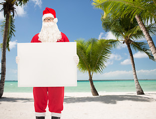 Image showing man in costume of santa claus with billboard