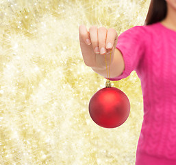 Image showing close up of woman in sweater with christmas ball