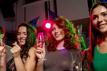 Image showing smiling friends with glasses of champagne in club